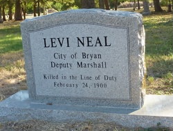 Deputy City Marshal Levi Neal's headstone placed in 2000 to replace the wooden marker in the Bryan Cemetery.
